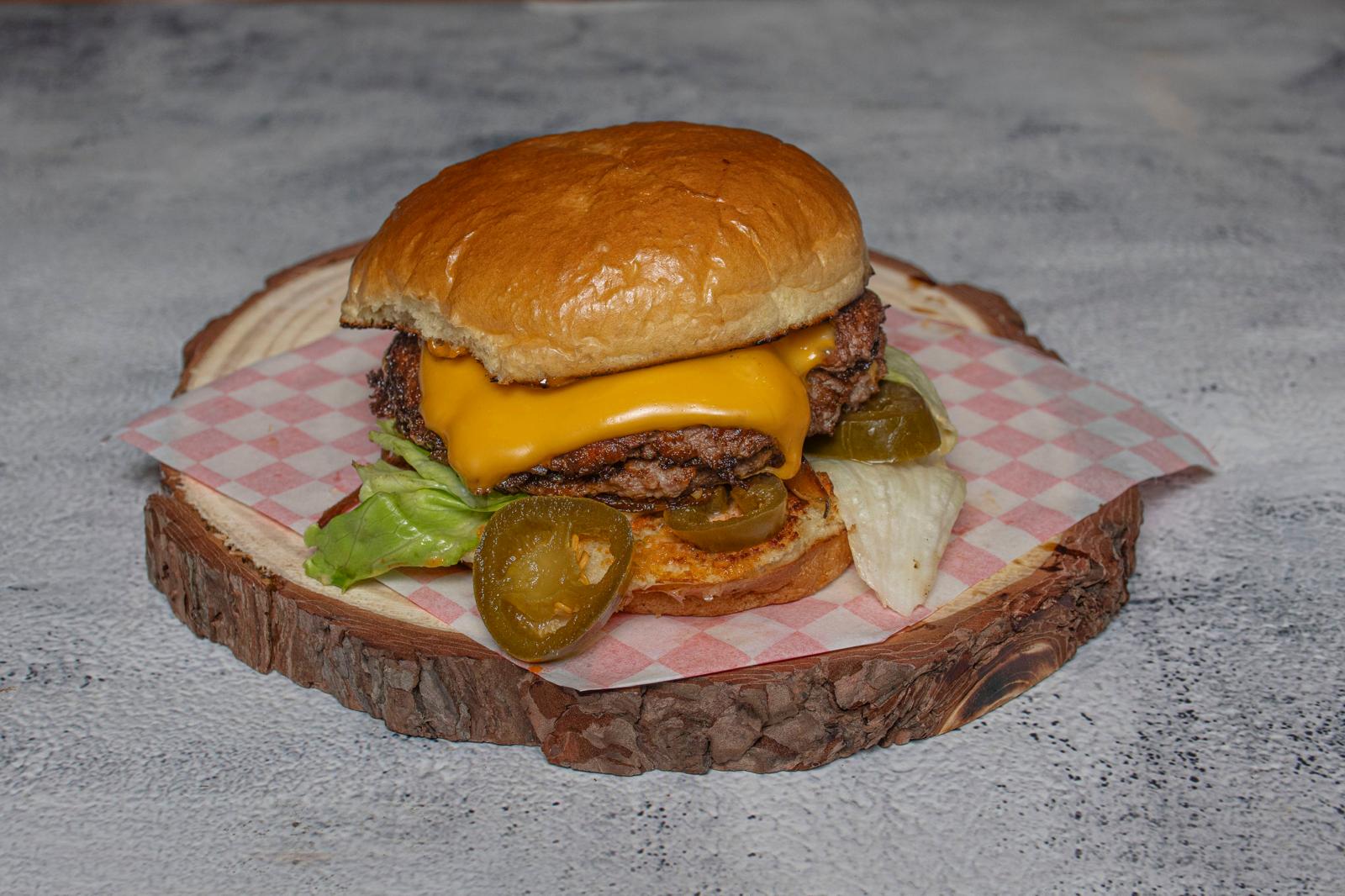Boss Smash burger with double beef, melted cheese and jalapenos
